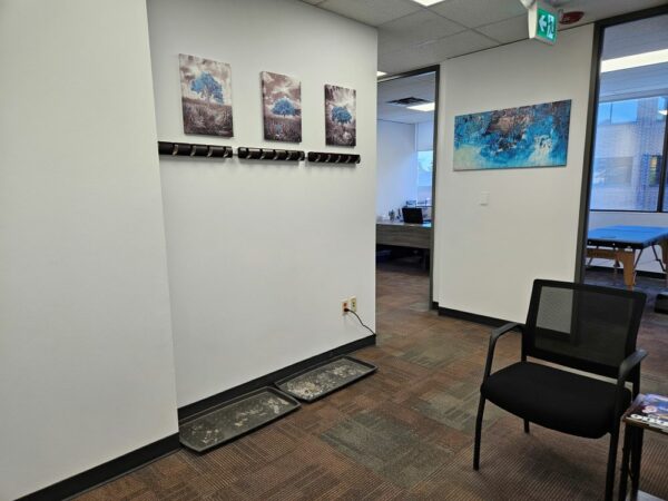 Waiting/reception area looking toward psychology office (left), and massage room (right).